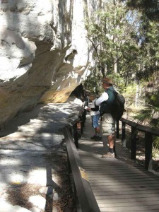 Tourist signing the visitor book at the Art Gallery, Carnarvon Gorge (photograph by Phillip Habgood).
